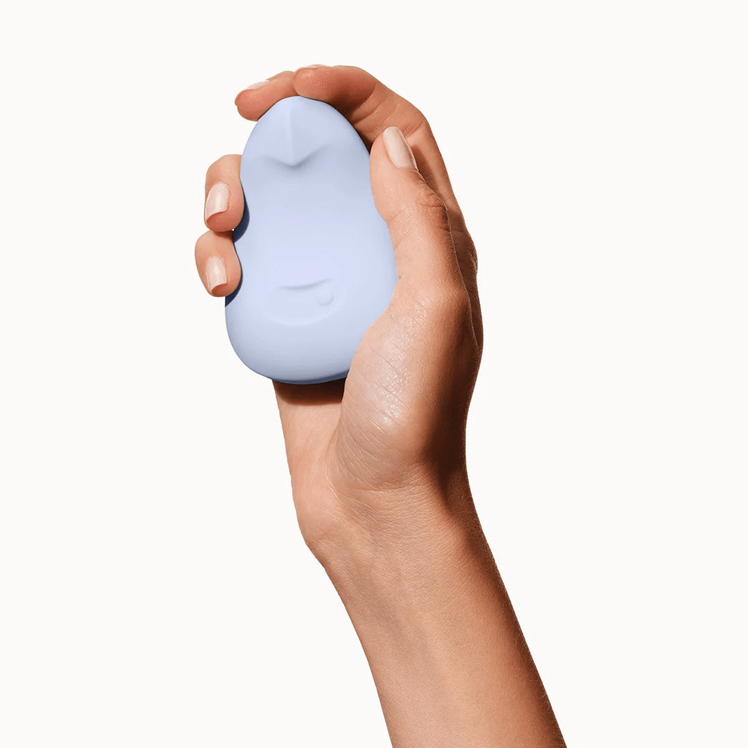 Dame ice blue Pom vibrator in hand. Product. Tool. Sex. Sold by Rythm.